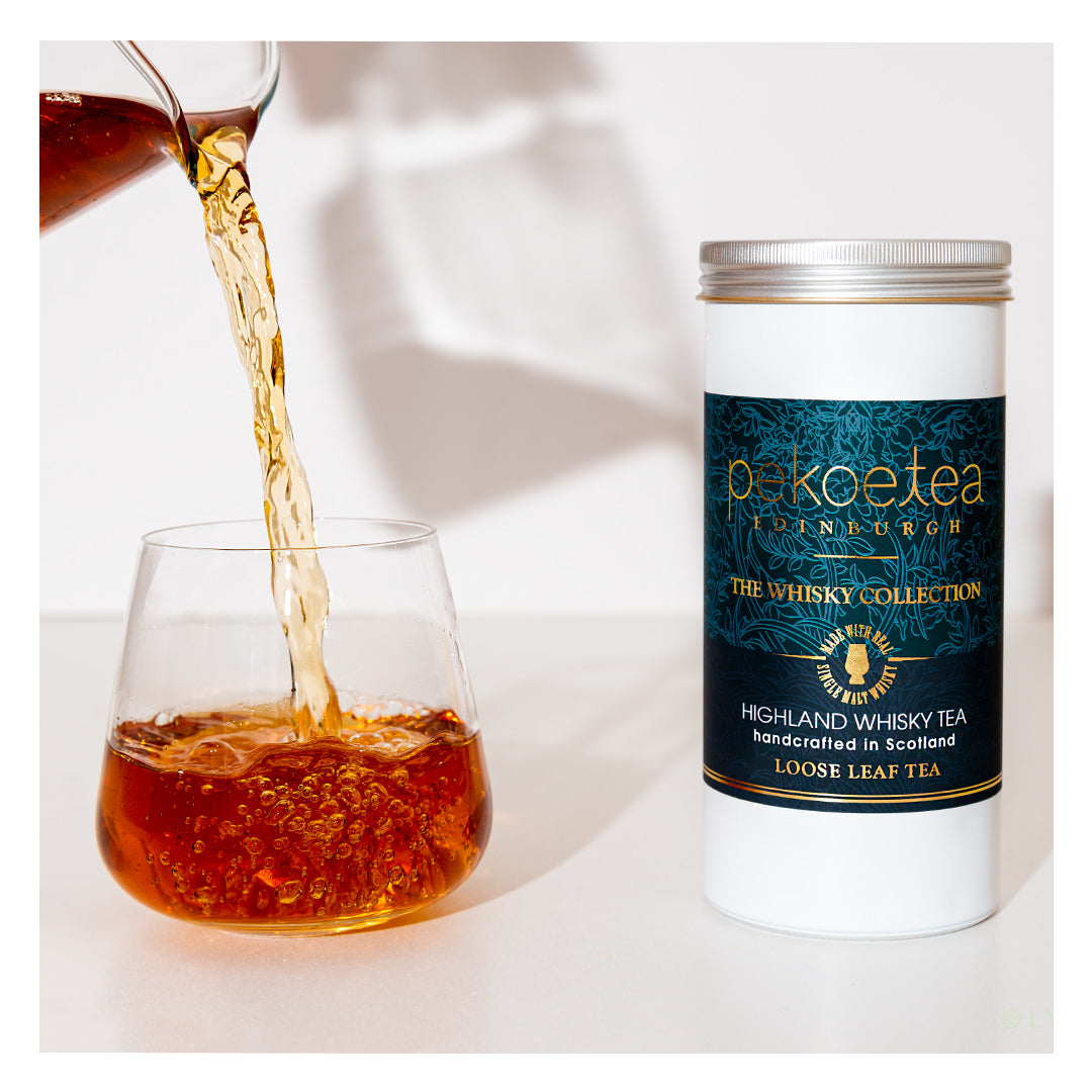 Whisky Flavoured Tea Caddy and Tea Pouring into Glass